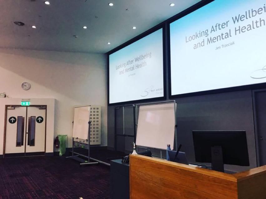 Therapist giving presentation at UCD about mental health and wellbeing